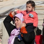 シリア政府軍によるホムスの包囲都市許さ女性と子どもの避難