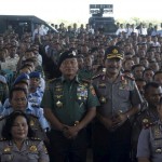 Indonesia's military chief Commander General Moeldoko and National Police Chief General Badrodin Haiti pose with members of the military and police after a briefing in Kupang, East Nusa Tenggara